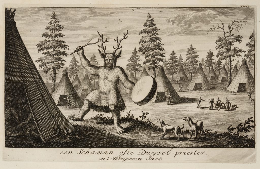 An engraving, black ink on aged paper. In a wooded area, surrounded by conical tent structures, a figure with clawed feet, antlers and a fur garment dances and plays a drum, mouth open.