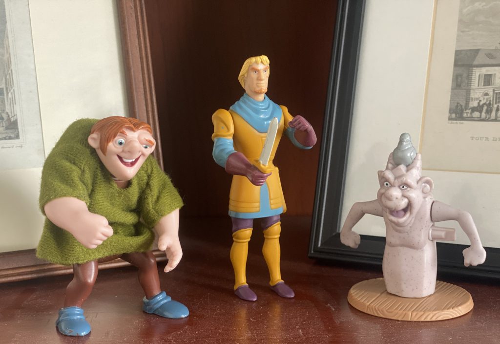 Three plastic figurine toys.