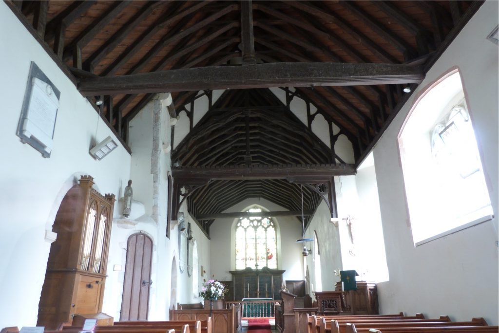 Interior image of a medieval church showing the nave, looking towards the east.