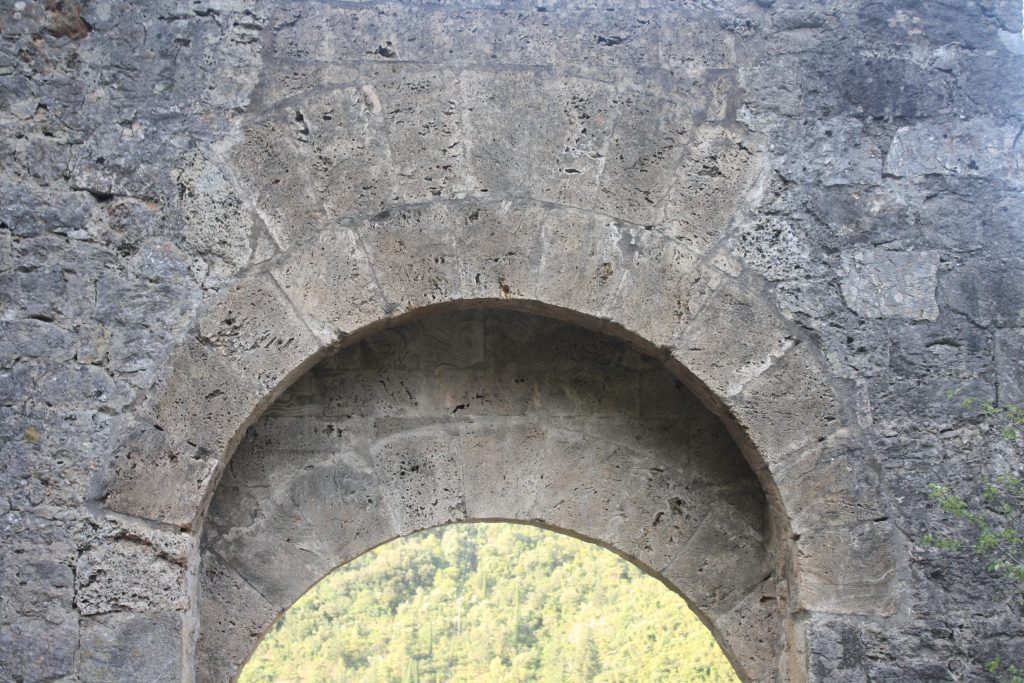 A stone arch over a doorway.