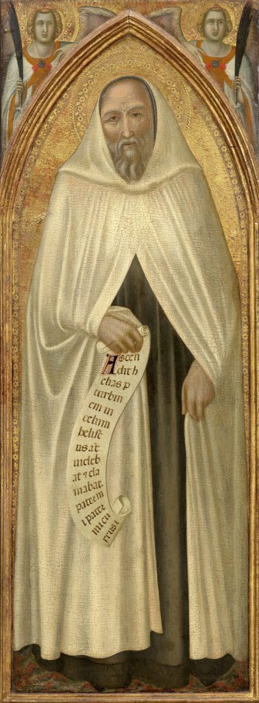 Standing man holding a scroll wearing the white habit of the Carmelite order.