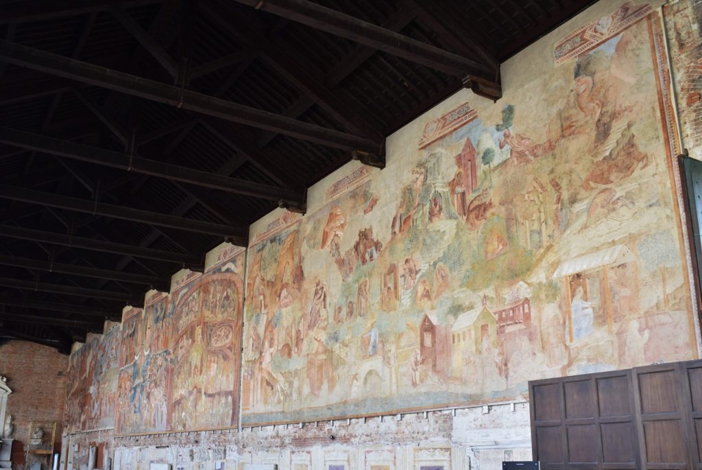 A series of wall paintings that have been restored and rehung in the cemetery building in Pisa.