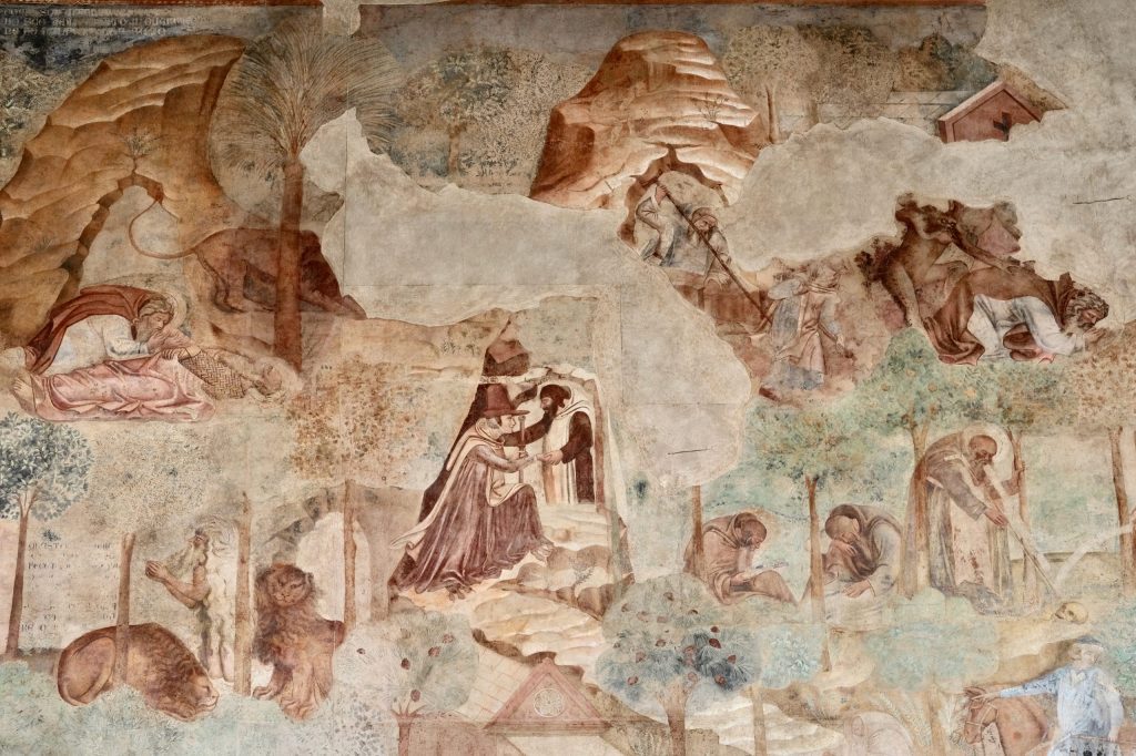 Detail of the Thebaid fresco, with scenes of early Christian desert saints and other hermits, with lions and demons, in a mountainous wilderness representing the Theban desert.