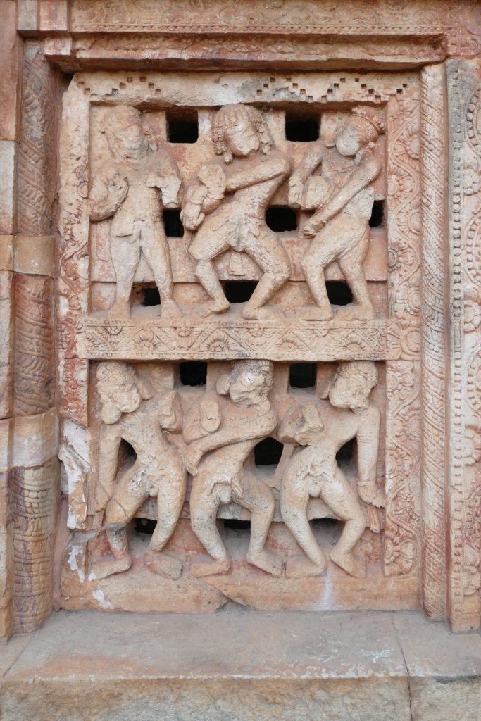 Alt text: Seventh century stone relief with dancers and musicians. From Parasuramesvara temple, Bhubaneswar, Odisha.