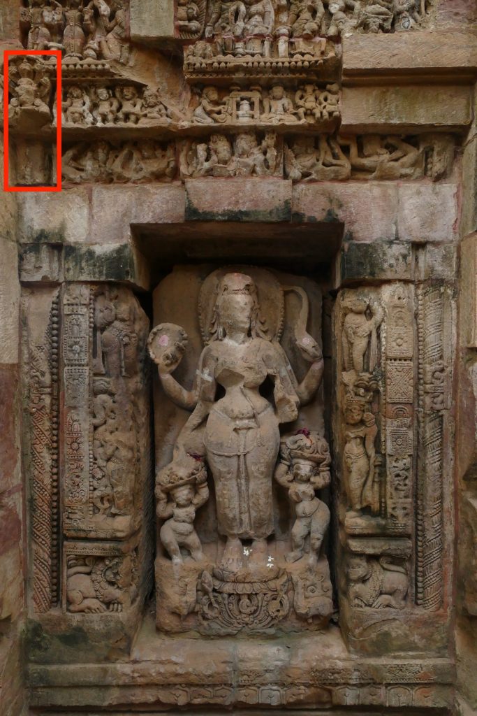 Seventh century stone temple, parsvadevata niche with Parvati sculpture and other reliefs. Svarnajalesvara, Bhubaneswar, Odisha.
