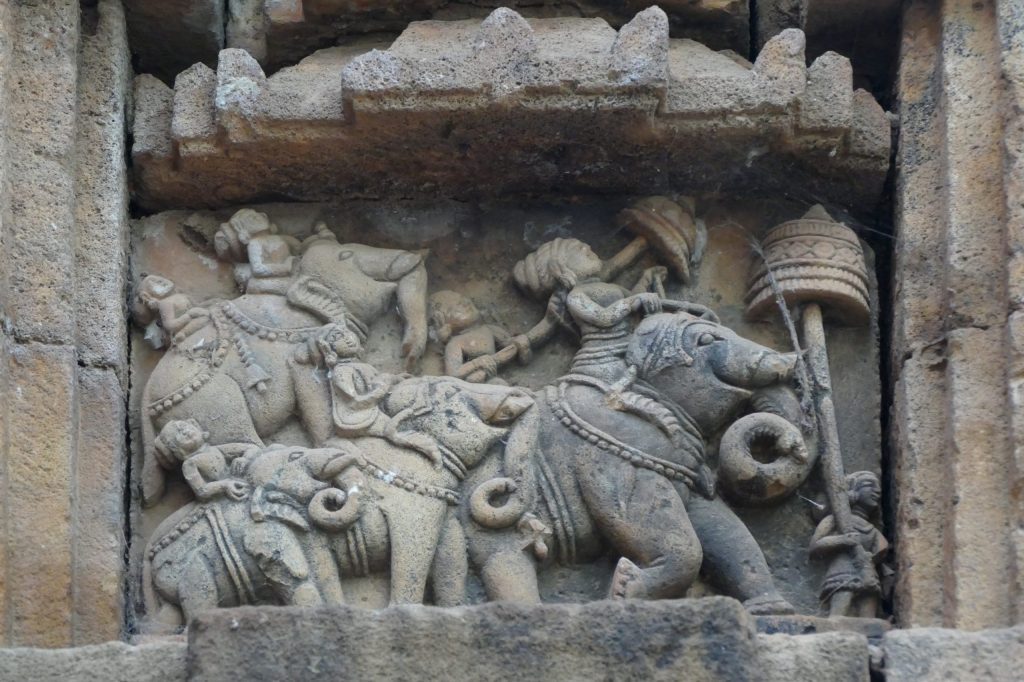 Stone relief with royal procession of elephants adorned with bells and parasols. Kapali matha, Bhubaneswar, Odisha.