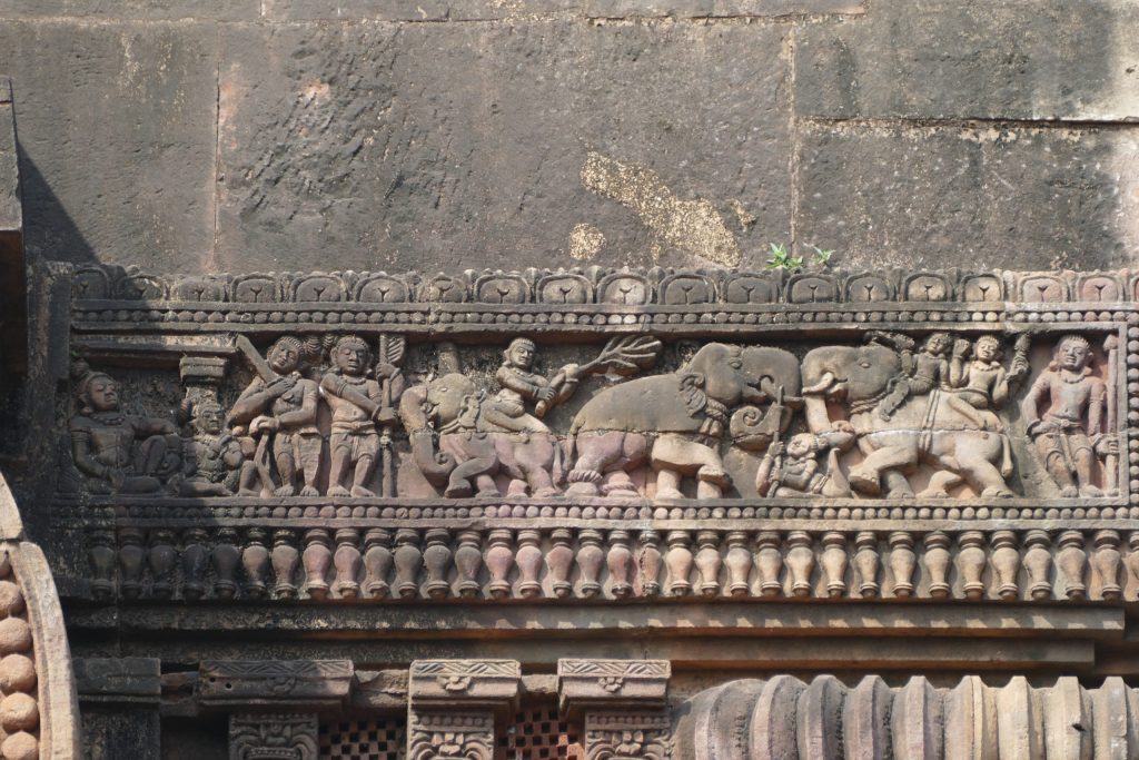 Stone relief with king, captured elephant in process of taming, guards and attendants. Vaital Deul, Bhubaneswar, Odisha.
