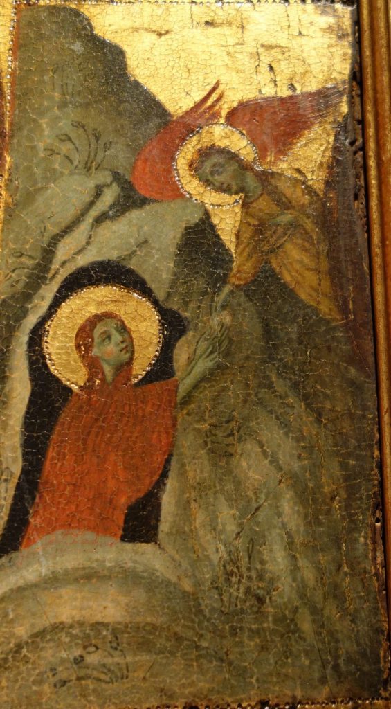 A detail from the Private Collection Vita Panel, which shows the scene on the right side, middle register, with the Magdalen facing right, kneeling within the mouth of her cave receiving Communion from an angel who is flying in from the left.