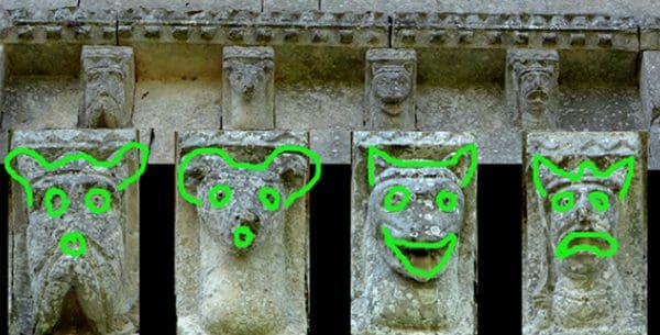 Row of four corbels whose shapes rhyme in a pattern of AABB.