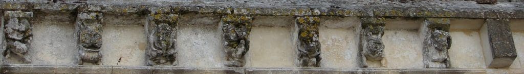 Seven corbels showing the previous horn and flute player in situ among monsters, an acrobat, and a fornicating couple.