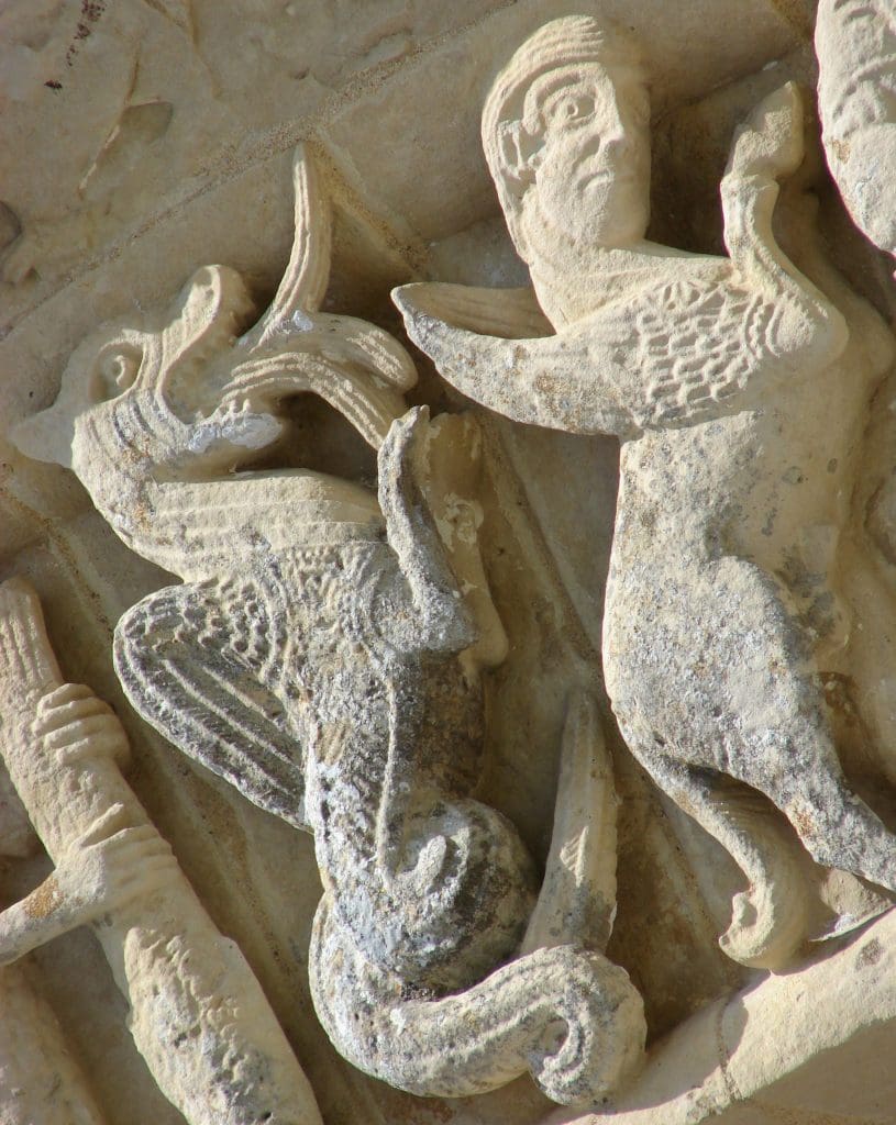 A dragon-like beast displays a huge phallic tail that juts from between its legs.