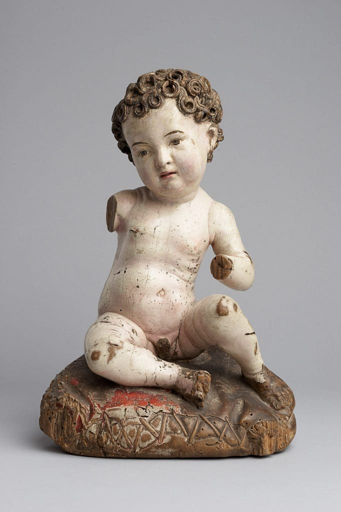 Signs of wear on this Swabian sculpture of a seated Christ Child indicate that it was probably inserted into a Marian or Saint Anne altarpiece and removed from there for separate use.